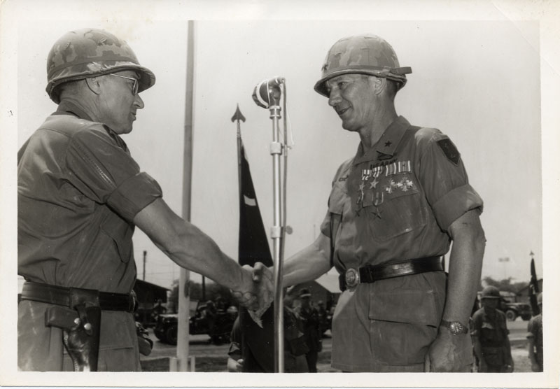 Major General Keith Ware presents Brigadier General William S. Coleman with awards.